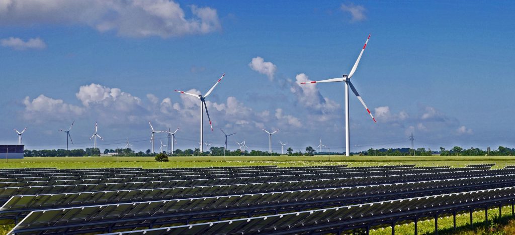 hybrid wind and solar farm on a bright sunny day
